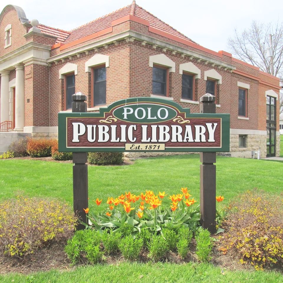 A sign announces you have arrived at the Polo Public Library.